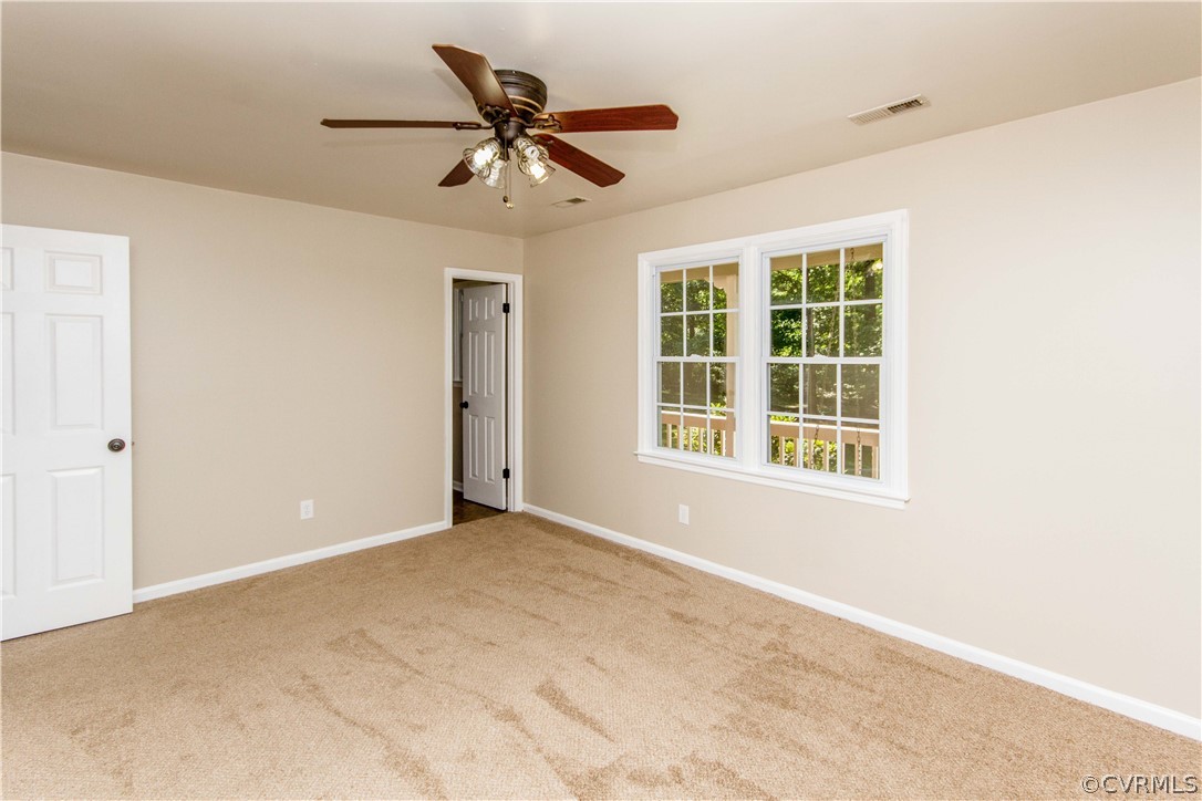15514 Nash Road Dewitt, VA 23840 - Photo 13 of 23 an empty room with windows and fan