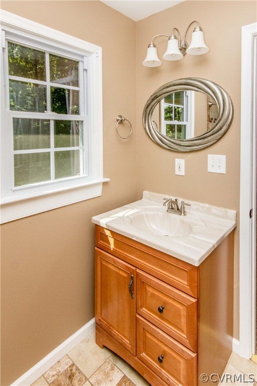 15514 Nash Road Dewitt, VA 23840 - Photo 19 of 23 a bathroom with a sink a mirror and a window