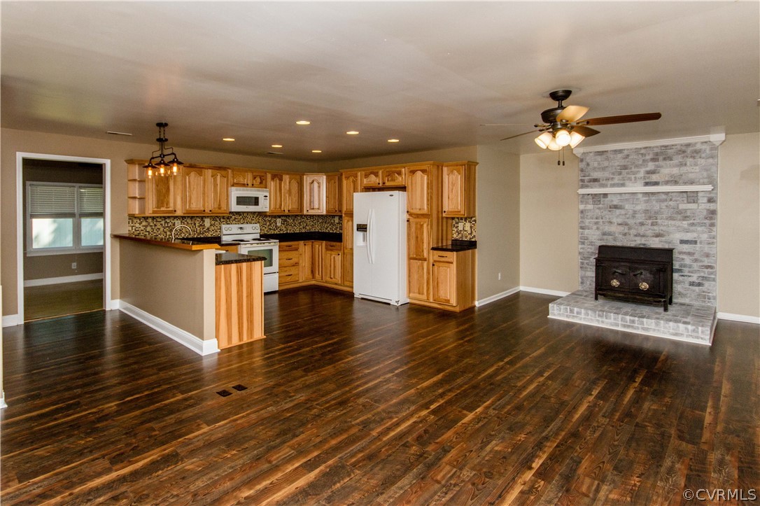 15514 Nash Road Dewitt, VA 23840 - Photo 3 of 23 an open kitchen with fireplace and wooden floor