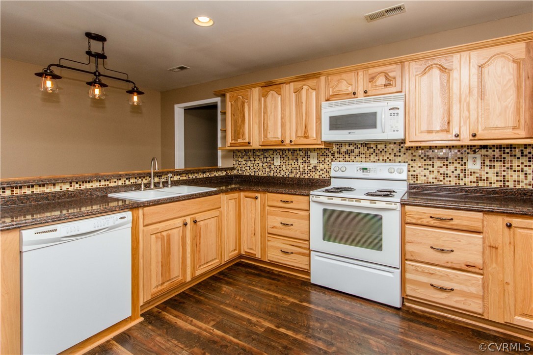 15514 Nash Road Dewitt, VA 23840 - Photo 4 of 23 a kitchen with granite countertop cabinets stainless steel appliances a sink and a window