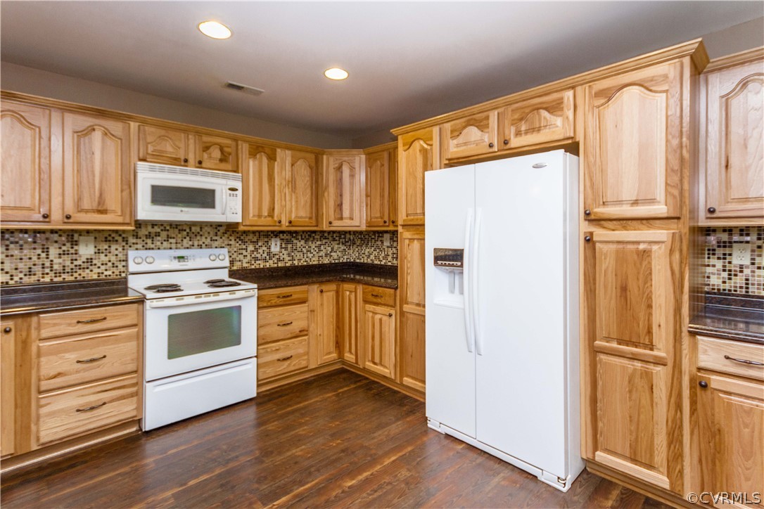 15514 Nash Road Dewitt, VA 23840 - Photo 5 of 23 a kitchen with white cabinets and white appliances