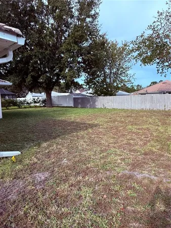 a view of a yard with an outdoor space