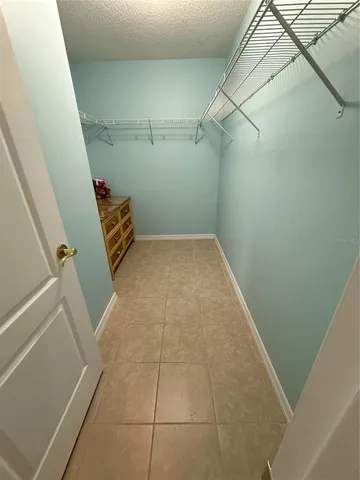 a view of storage and utility room with racks on the wall