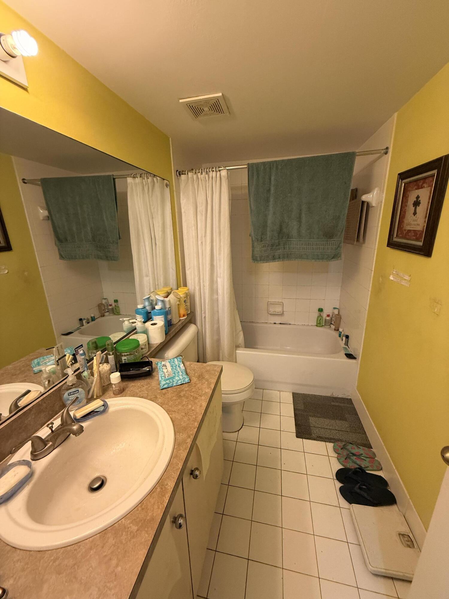 520 Southwest 111th Avenue, Unit 202 Pembroke Pines, FL 33025 - Photo 12 of 20 a bathroom with a sink and a mirror