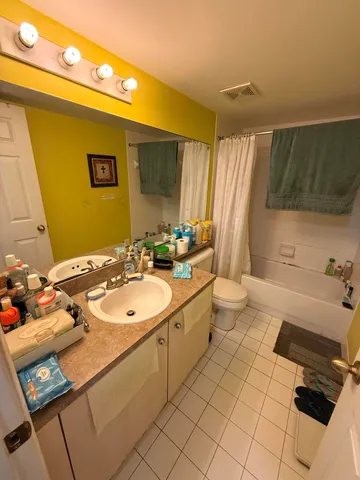 a bathroom with a sink double vanity and a mirror