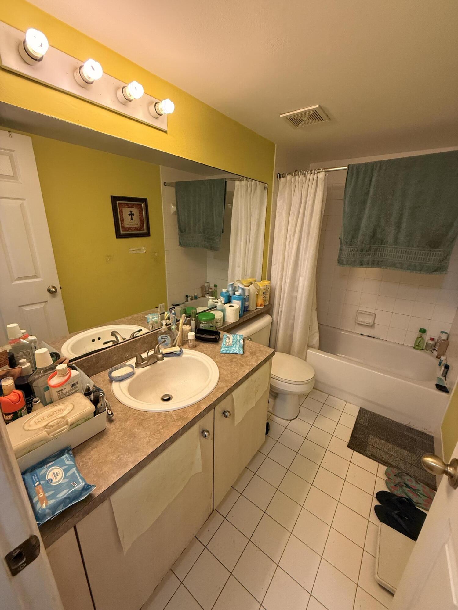 520 Southwest 111th Avenue, Unit 202 Pembroke Pines, FL 33025 - Photo 13 of 20 a bathroom with a sink double vanity and a mirror