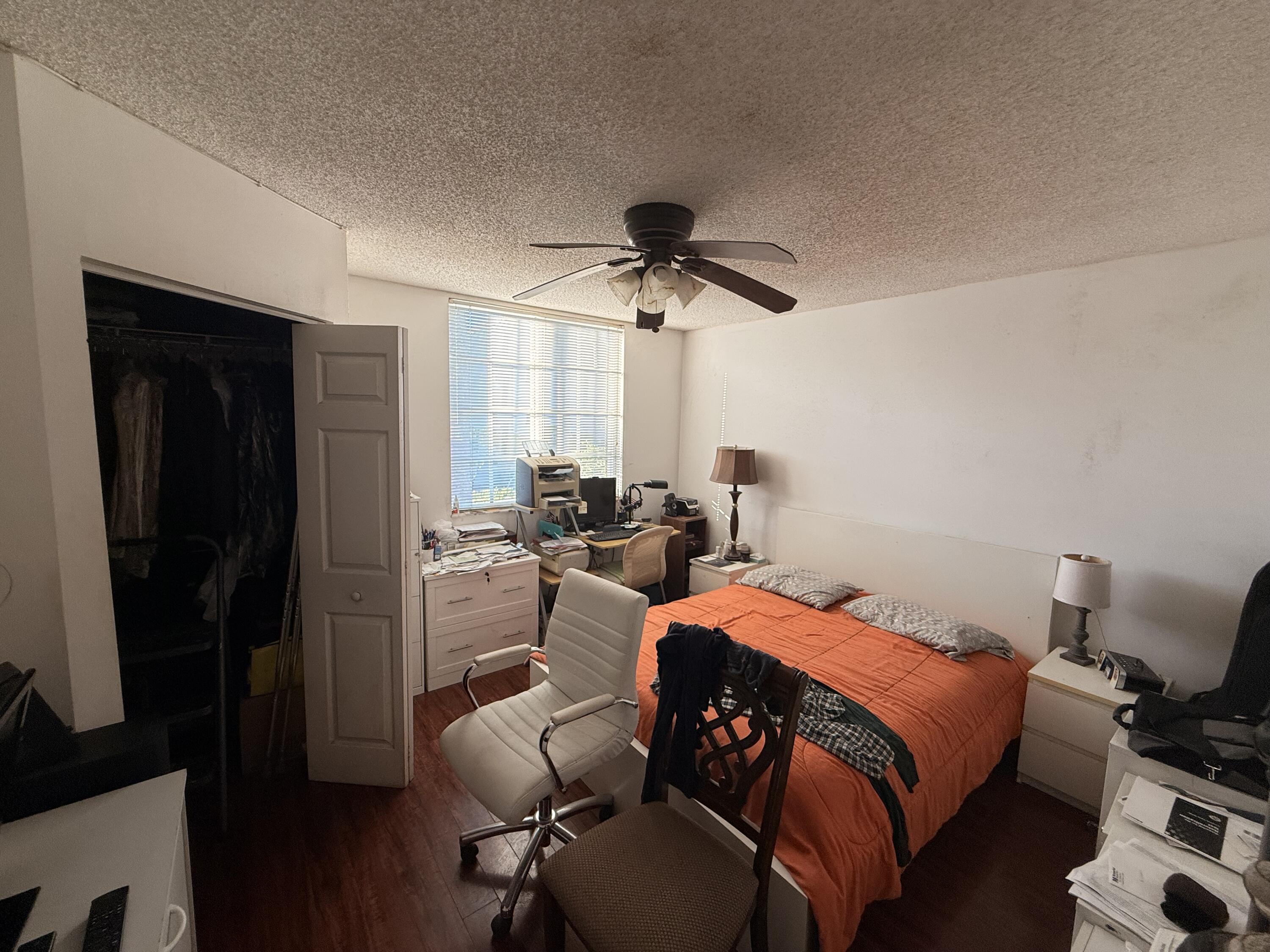 520 Southwest 111th Avenue, Unit 202 Pembroke Pines, FL 33025 - Photo 15 of 20 a bed room with a bed and a window