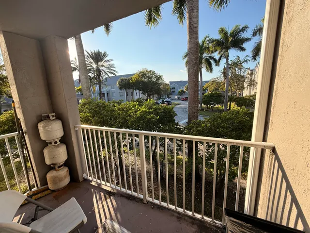 a view of a balcony with wooden floor