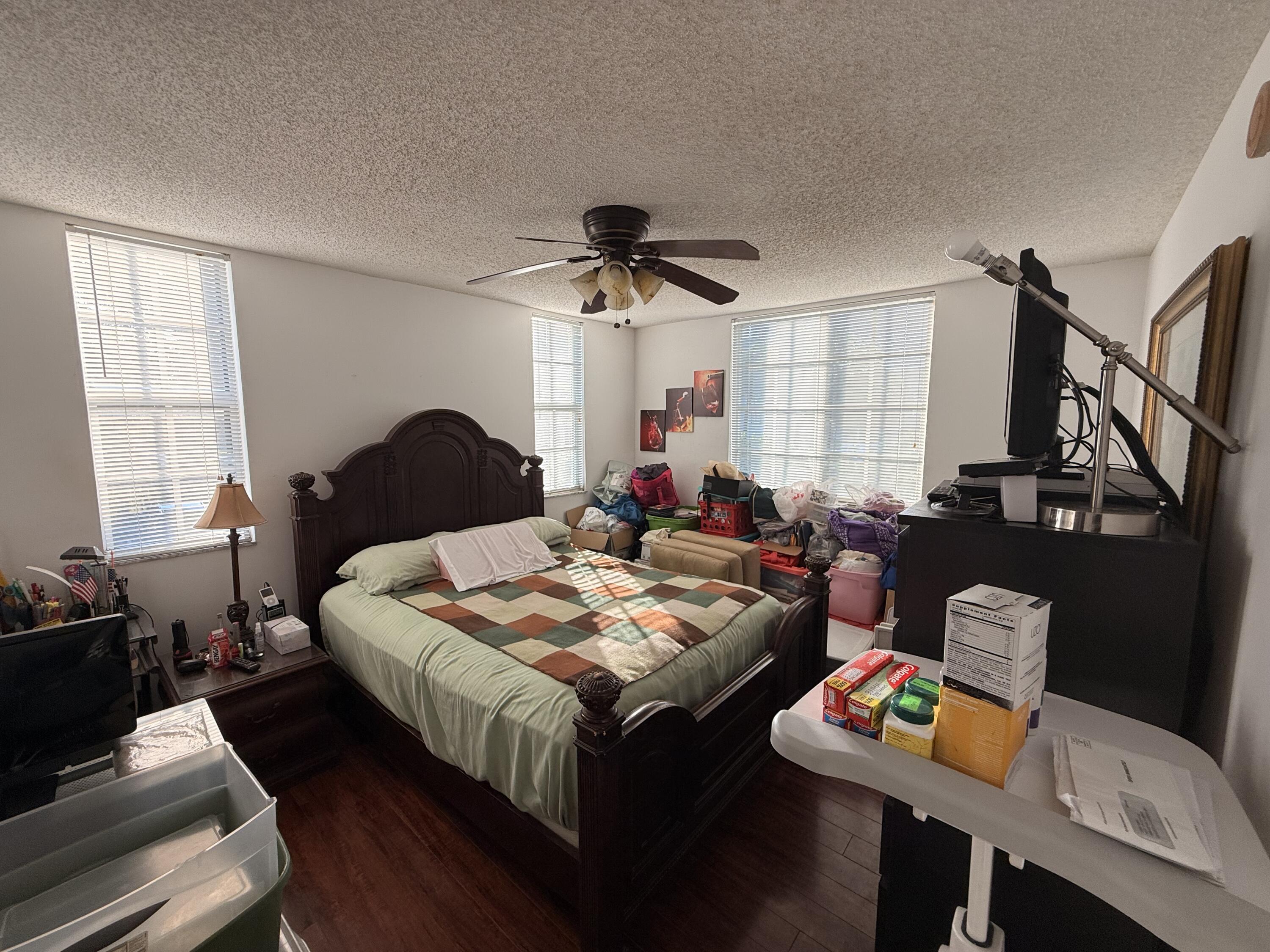 520 Southwest 111th Avenue, Unit 202 Pembroke Pines, FL 33025 - Photo 10 of 20 a bed room with furniture and a window