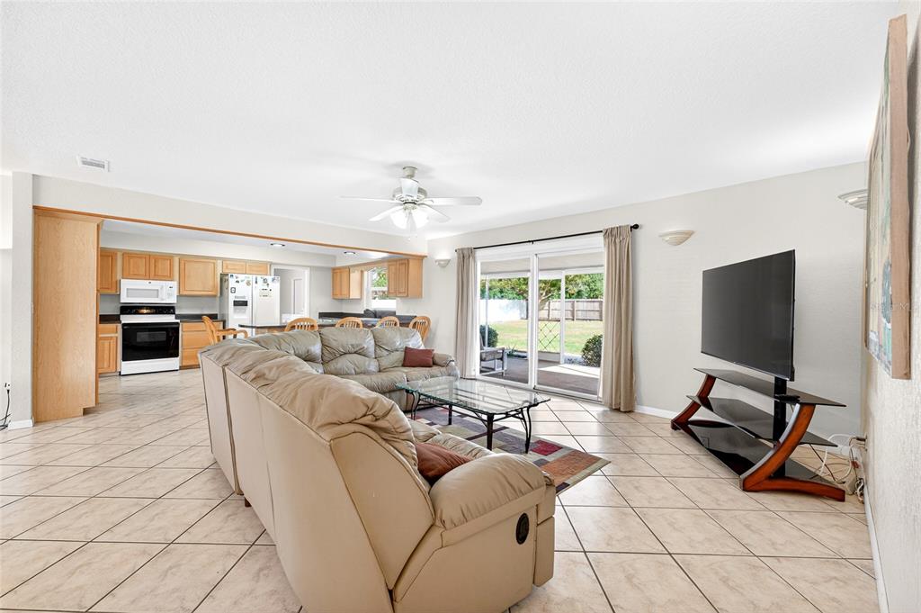 1409 Bryan Road Brandon, FL 33511 - Photo 18 of 73 a living room with furniture and a flat screen tv