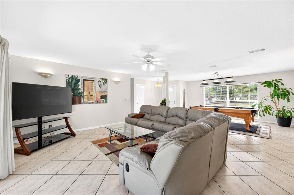 1409 Bryan Road Brandon, FL 33511 - Photo 19 of 73 a living room with furniture and a flat screen tv