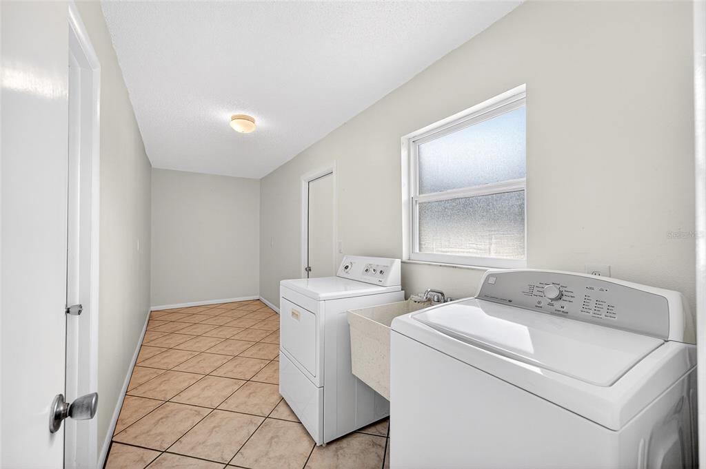 1409 Bryan Road Brandon, FL 33511 - Photo 33 of 73 a utility room with dryer and washer