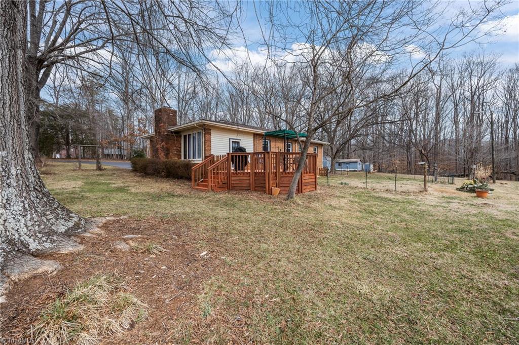 289 Vfw Road Reidsville, NC 27320 - Photo 36 of 45 Another angle showing deck and backyard of the home.