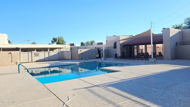 a view of a patio with a table and chairs