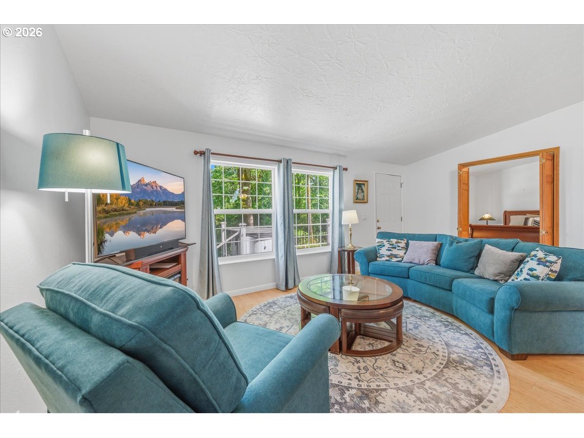 475 East 9th Street Rainier, OR 97048 - Photo 3 of 43 a living room with furniture and a large window