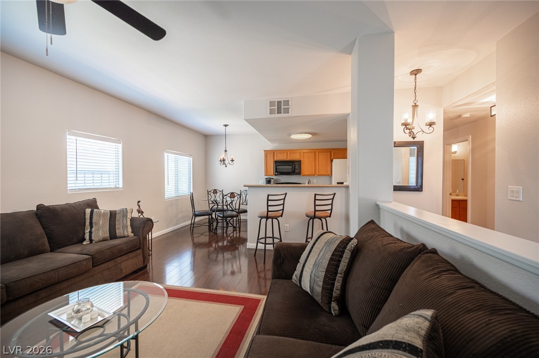 7701 West Robindale Road, Unit 274 Las Vegas, NV 89113 - Photo 8 of 38 This inviting space combines living, dining, and kitchen areas for seamless everyday living.