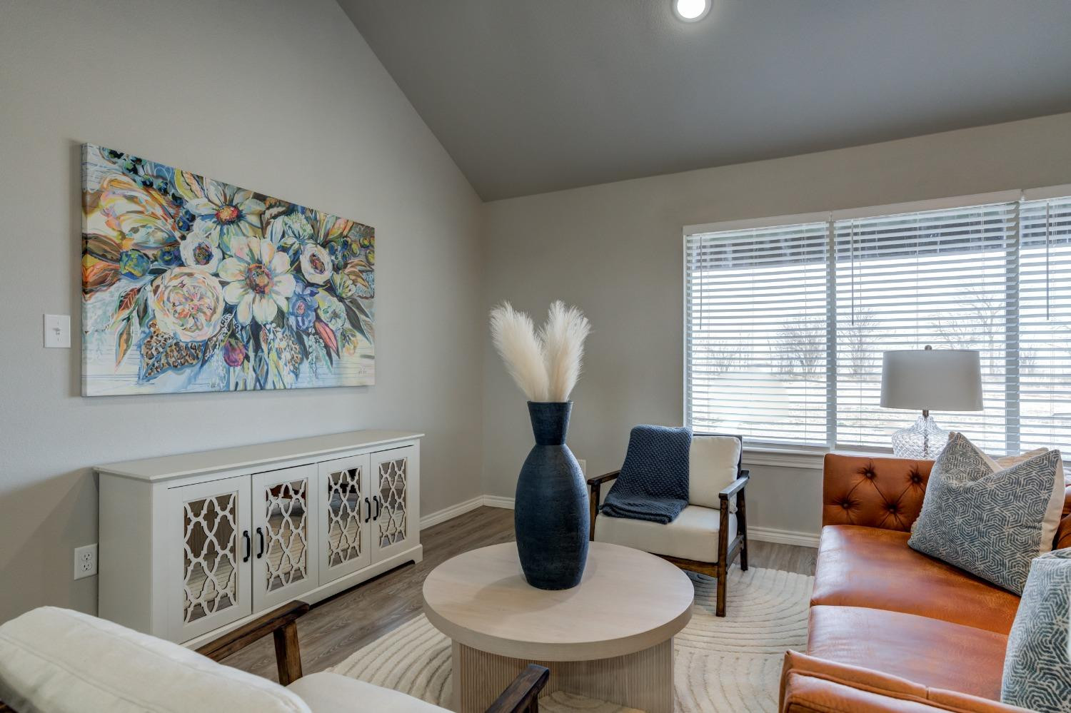 9013 County Road 6100 Shallowater, TX 79363 - Photo 11 of 49 a living room with furniture and a large window