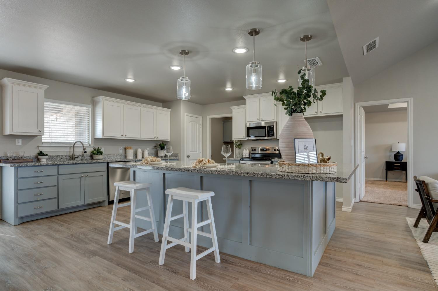 9013 County Road 6100 Shallowater, TX 79363 - Photo 19 of 49 a kitchen with a table and chairs in it
