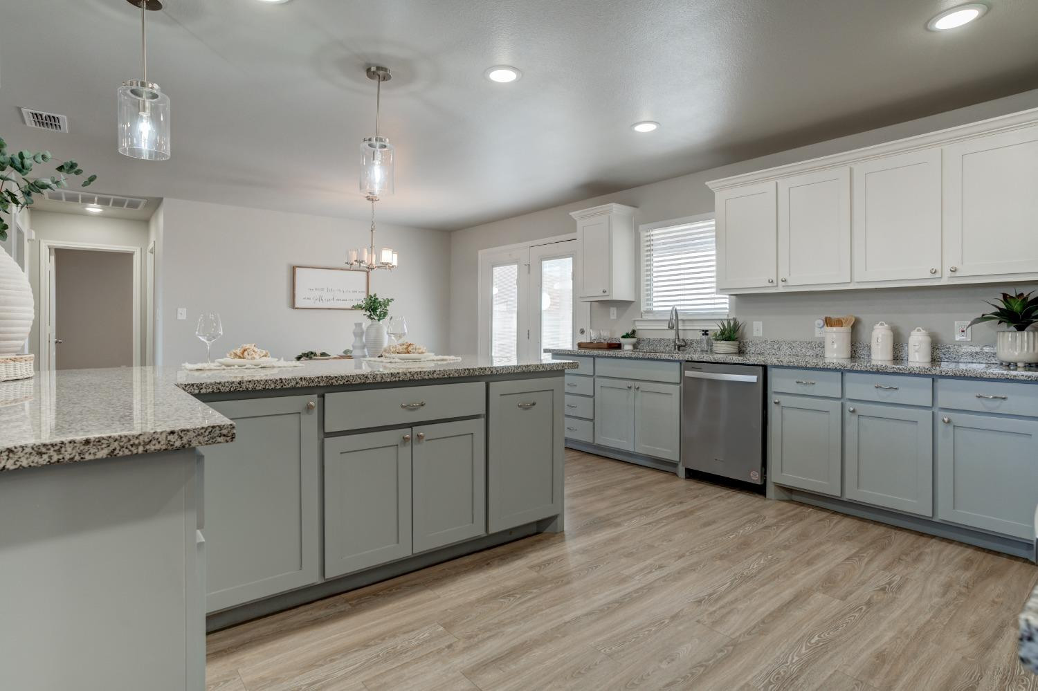 9013 County Road 6100 Shallowater, TX 79363 - Photo 22 of 49 a kitchen with a sink cabinets and wooden floor