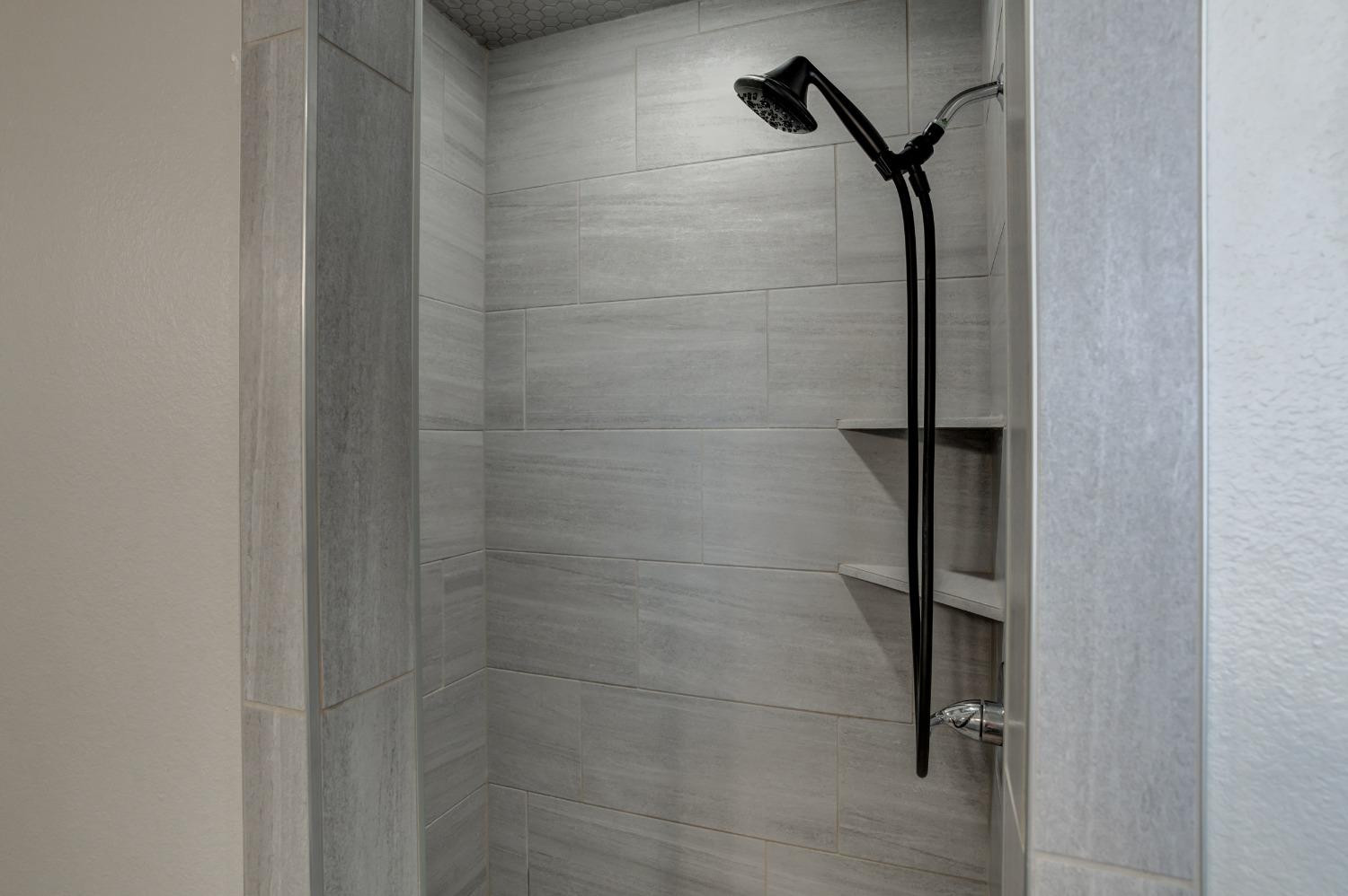 9013 County Road 6100 Shallowater, TX 79363 - Photo 37 of 49 a bathroom with a shower