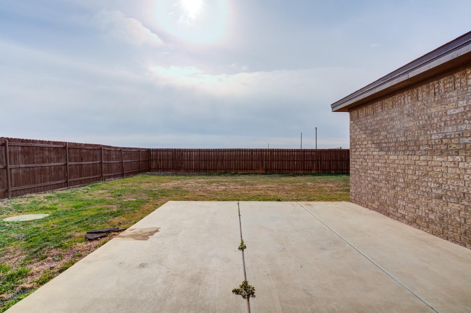 9013 County Road 6100 Shallowater, TX 79363 - Photo 46 of 49 a view of backyard space and wooden fence