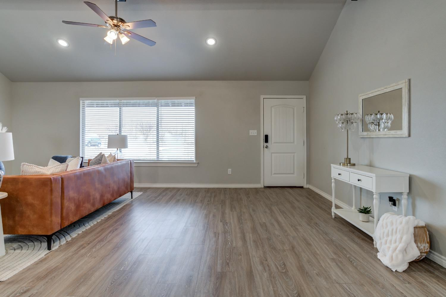 9013 County Road 6100 Shallowater, TX 79363 - Photo 7 of 49 a living room with furniture and a wooden floor