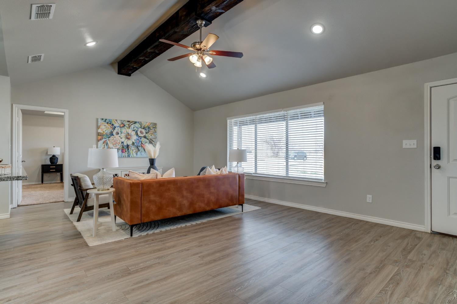 9013 County Road 6100 Shallowater, TX 79363 - Photo 8 of 49 a living room with furniture and a chandelier