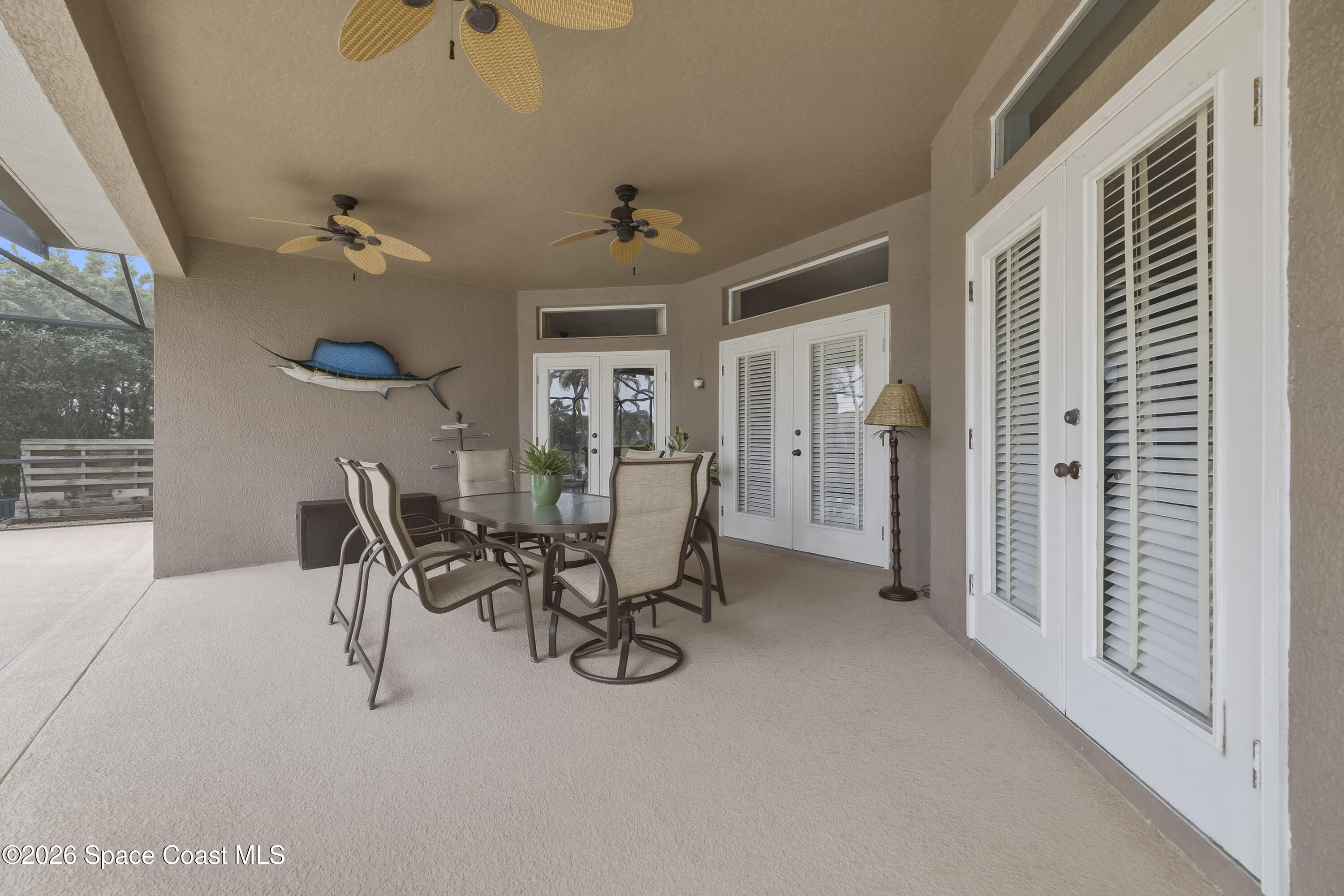 1643 Long Pine Road Melbourne, FL 32940 - Photo 52 of 63 a view of a dining room with furniture and a chandelier