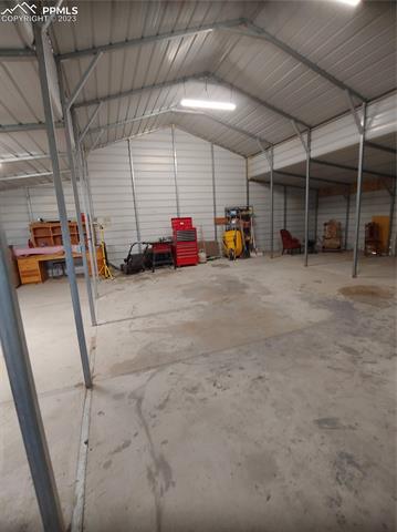 34015 Big Springs Road Yoder, CO 80864 - Photo 14 of 19 inside the barn from the 10ft roll up door