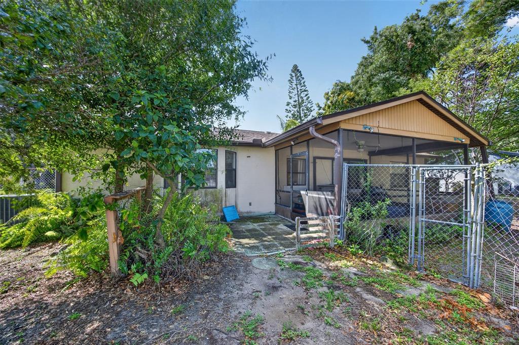 464 Coronado Road Venice, FL 34293 - Photo 20 of 28 a view of a house with a yard and potted plants