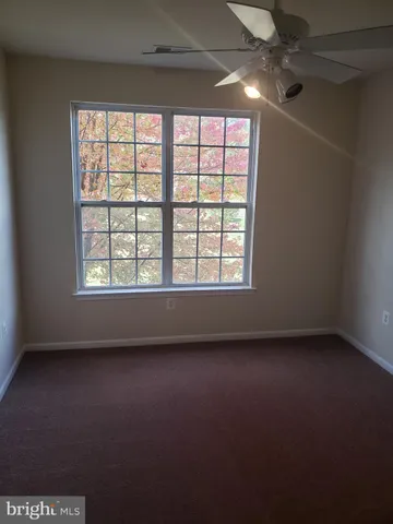 an empty room with a empty space and windows