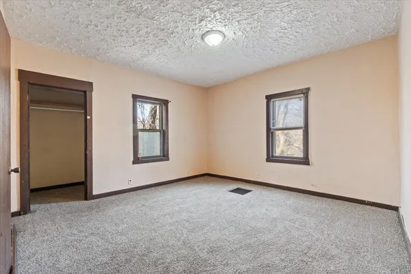 an empty room with windows