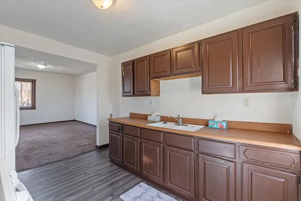 a kitchen with a sink and cabinets