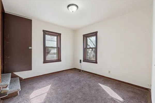 an empty room with windows