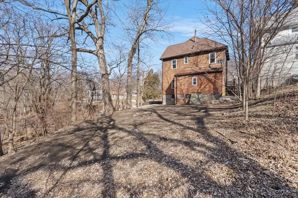a view of a house with a snow in the yard