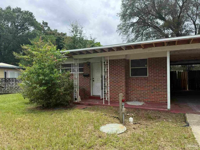 a backyard of a house with seating space