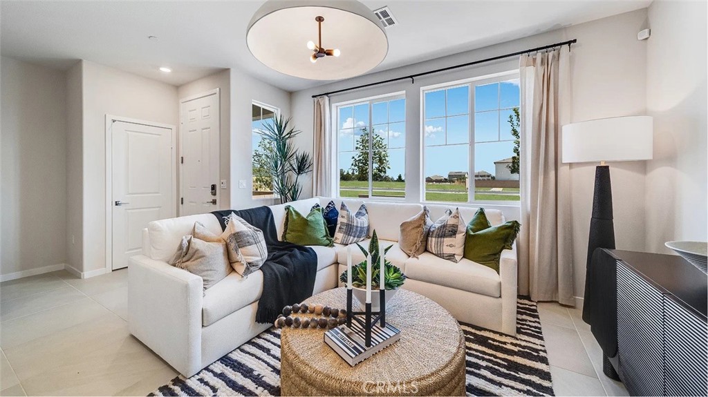 2571 Cloudview Privado Ontario, CA 91761 - Photo 4 of 19 a living room with furniture and a large window