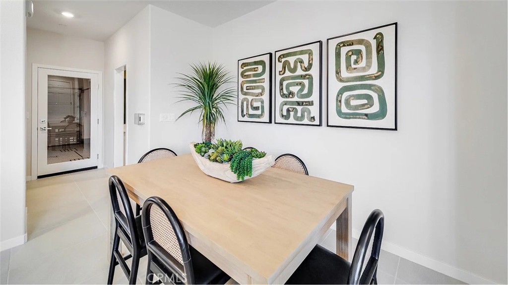 2571 Cloudview Privado Ontario, CA 91761 - Photo 5 of 19 a view of a dining room with furniture and window