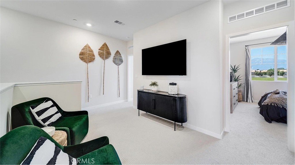 2571 Cloudview Privado Ontario, CA 91761 - Photo 6 of 19 a living room with furniture and a flat screen tv
