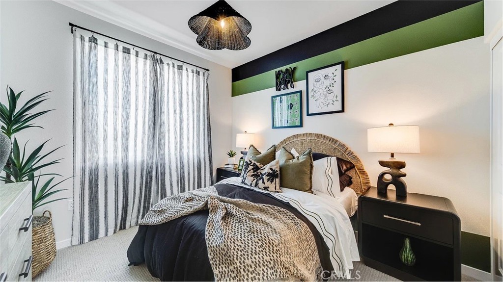 2571 Cloudview Privado Ontario, CA 91761 - Photo 7 of 19 a bedroom with a bed and a large mirror