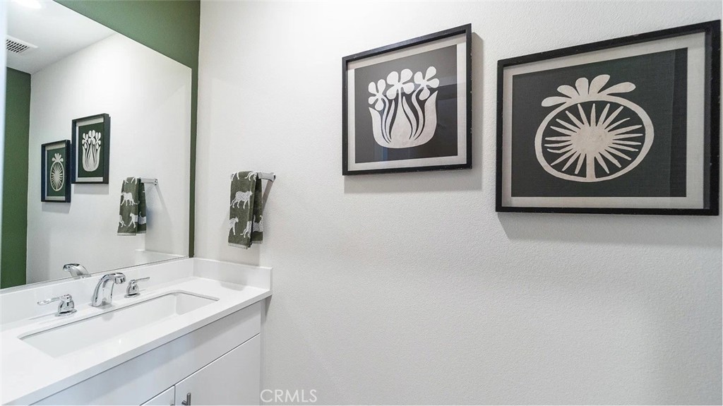 2571 Cloudview Privado Ontario, CA 91761 - Photo 8 of 19 a bathroom with a sink and a mirror