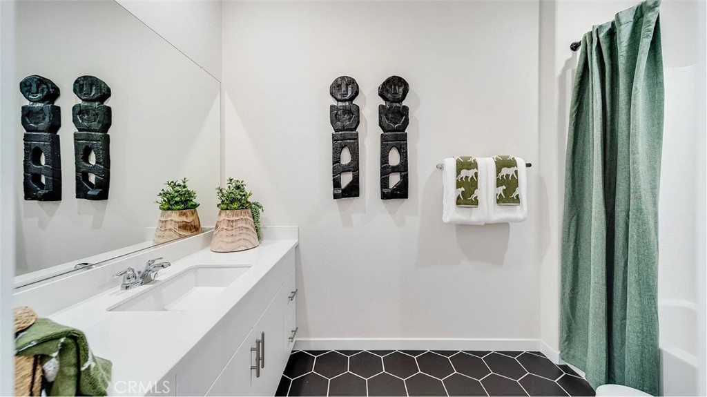 2571 Cloudview Privado Ontario, CA 91761 - Photo 10 of 19 a bathroom with a sink and a mirror