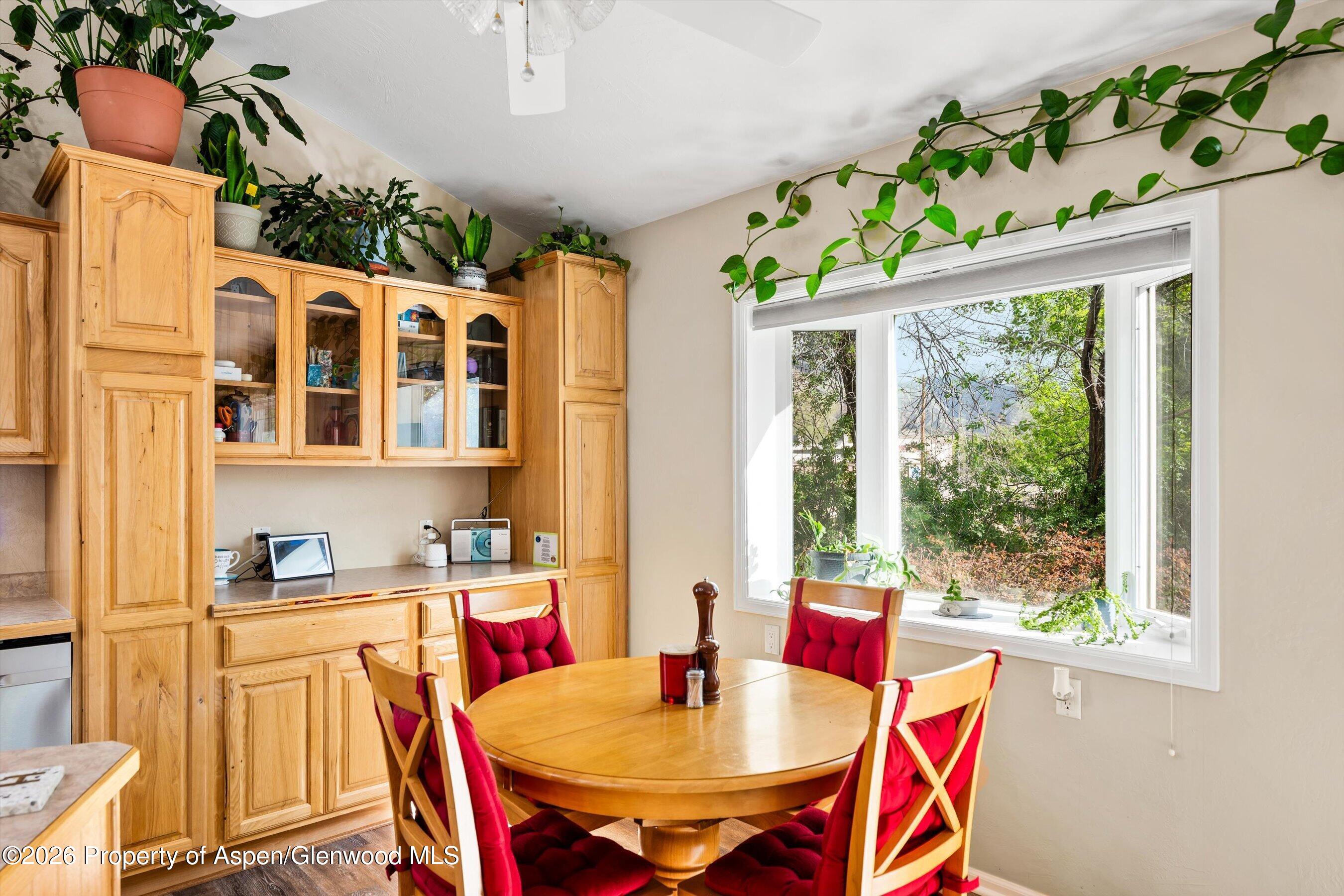 127 Cardinal Way Parachute, CO 81635 - Photo 12 of 41 a dining room with furniture a rug and wooden floor