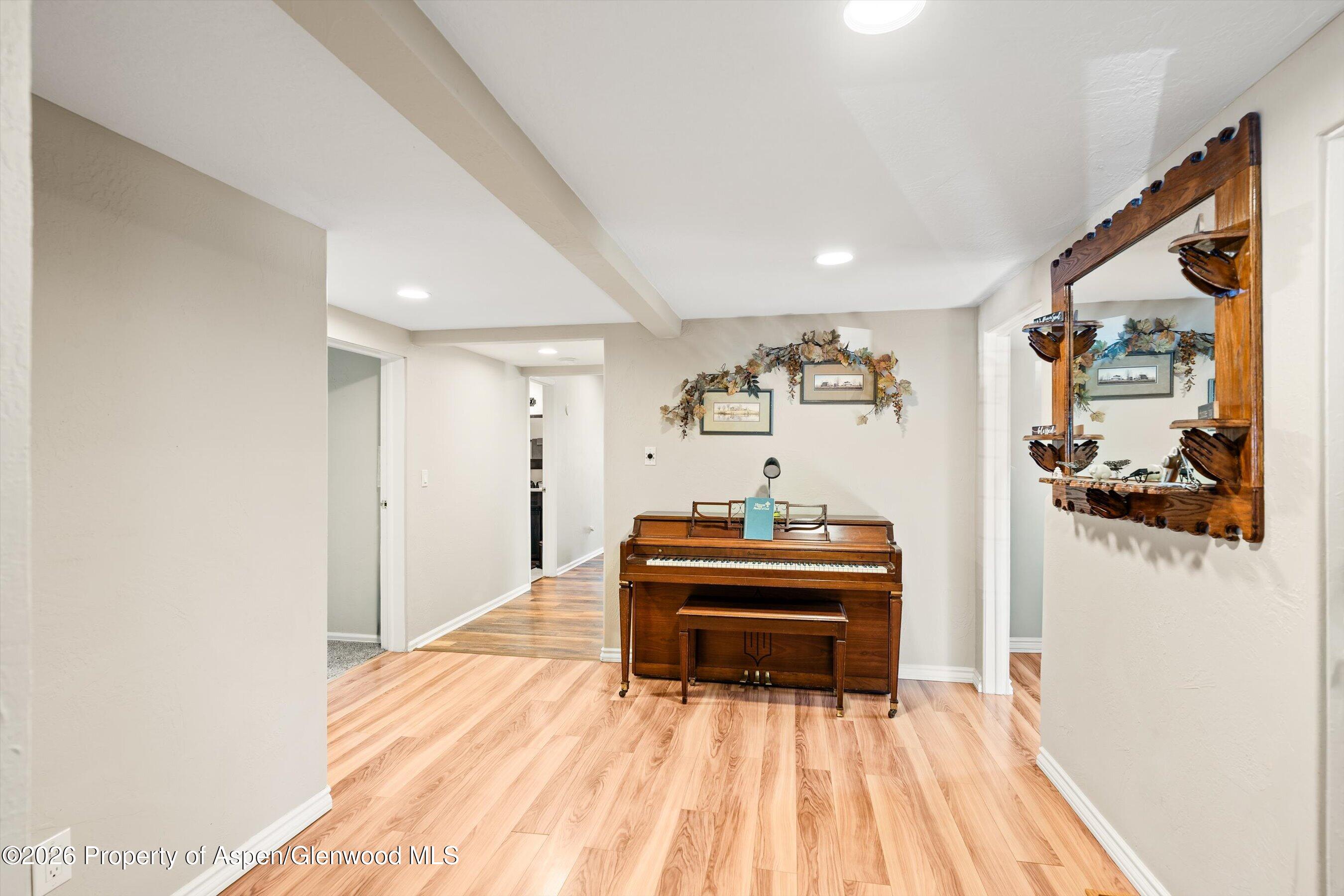 127 Cardinal Way Parachute, CO 81635 - Photo 16 of 41 a living room with furniture and a wooden floor