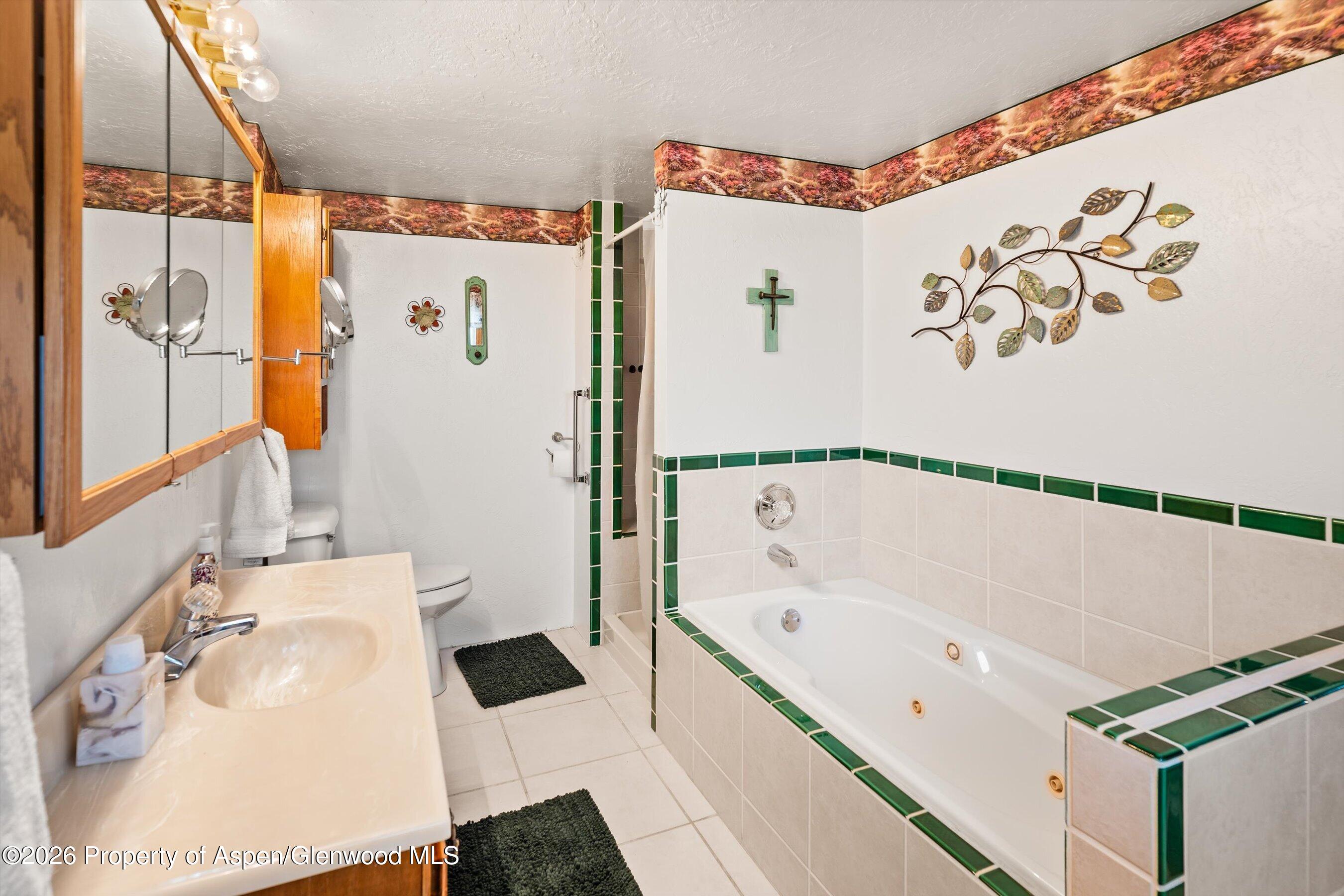 127 Cardinal Way Parachute, CO 81635 - Photo 18 of 41 a bathroom with a bathtub and a shower