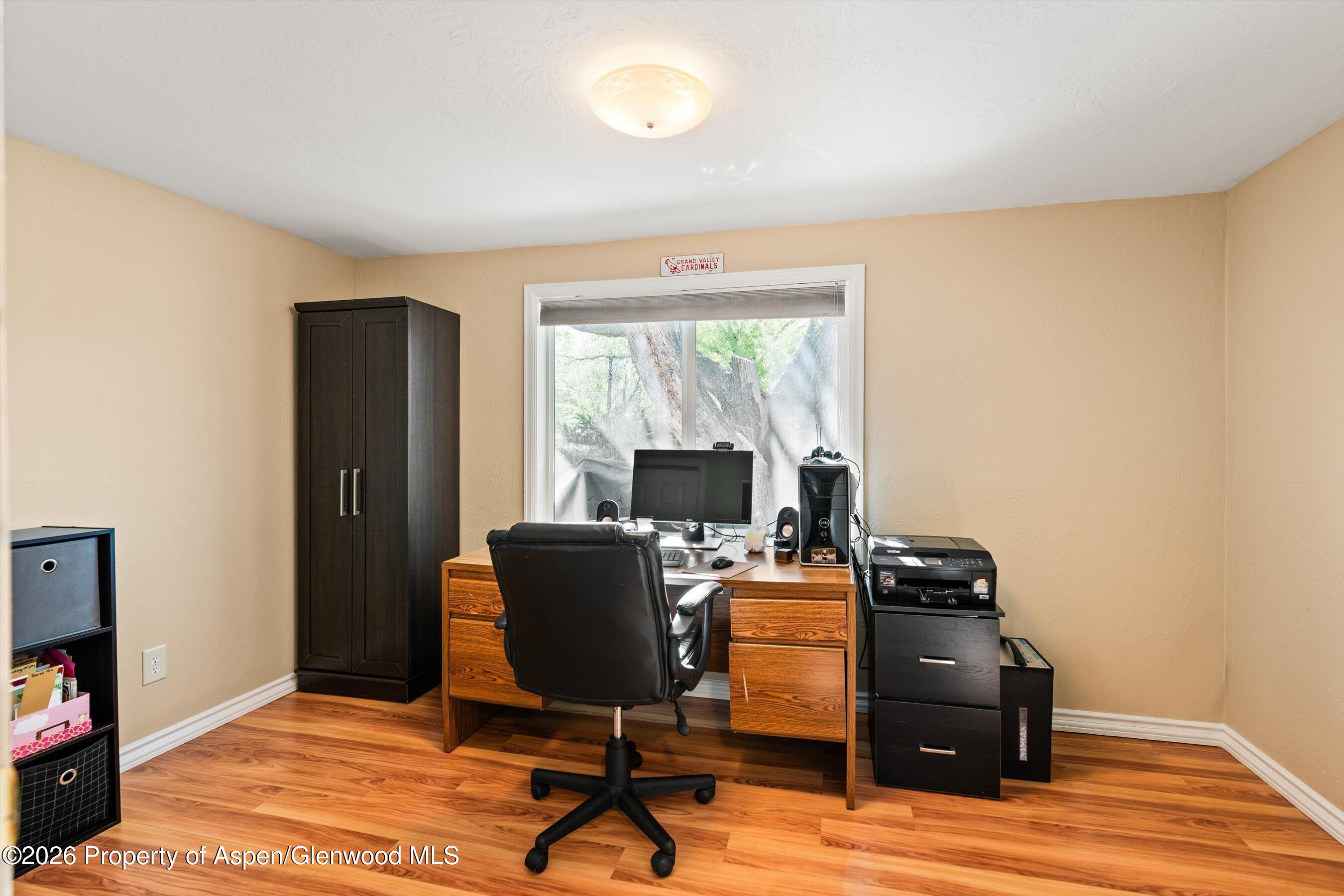 127 Cardinal Way Parachute, CO 81635 - Photo 20 of 41 a view of a workspace with furniture and a window