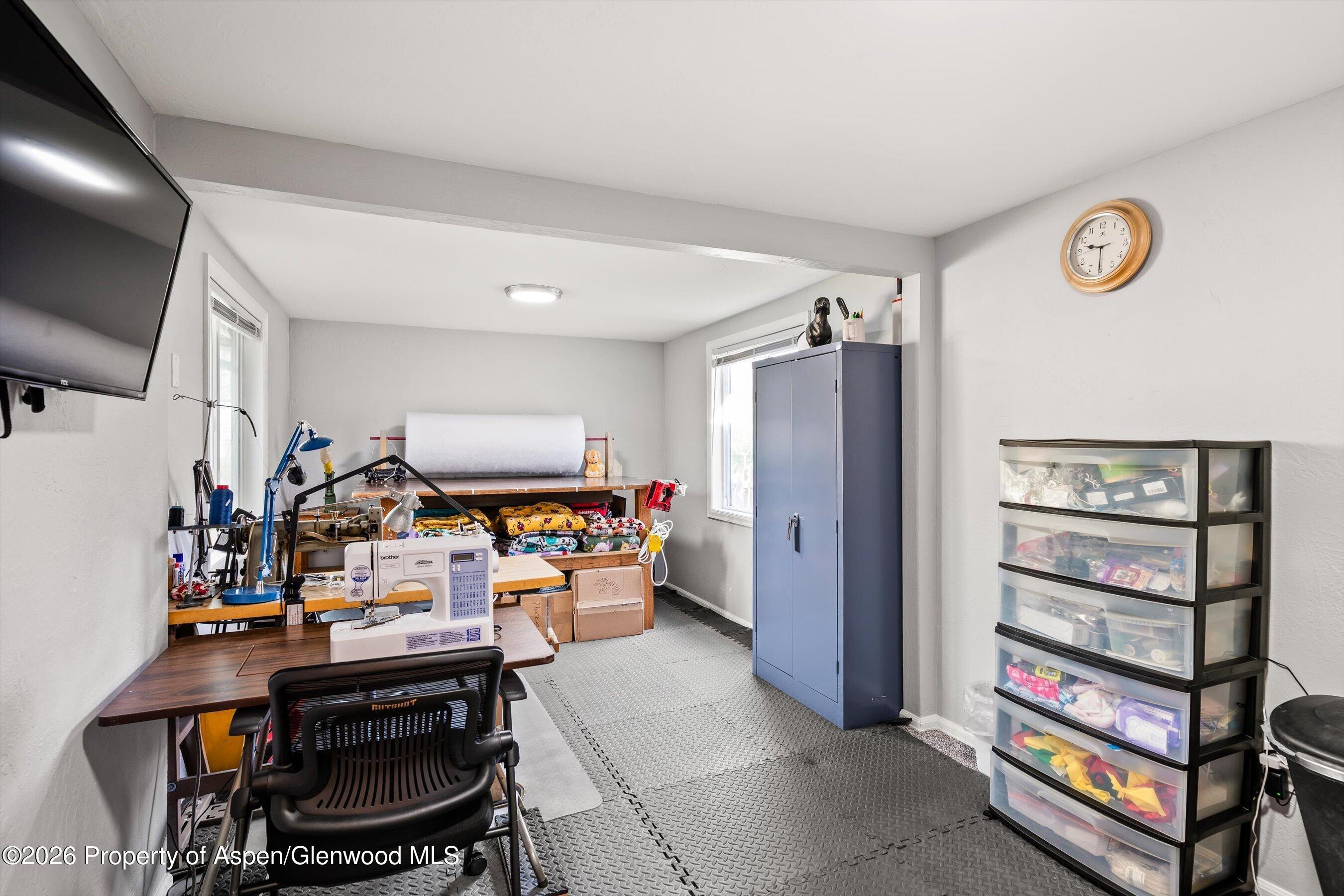 127 Cardinal Way Parachute, CO 81635 - Photo 21 of 41 a view of a workspace with furniture and a window