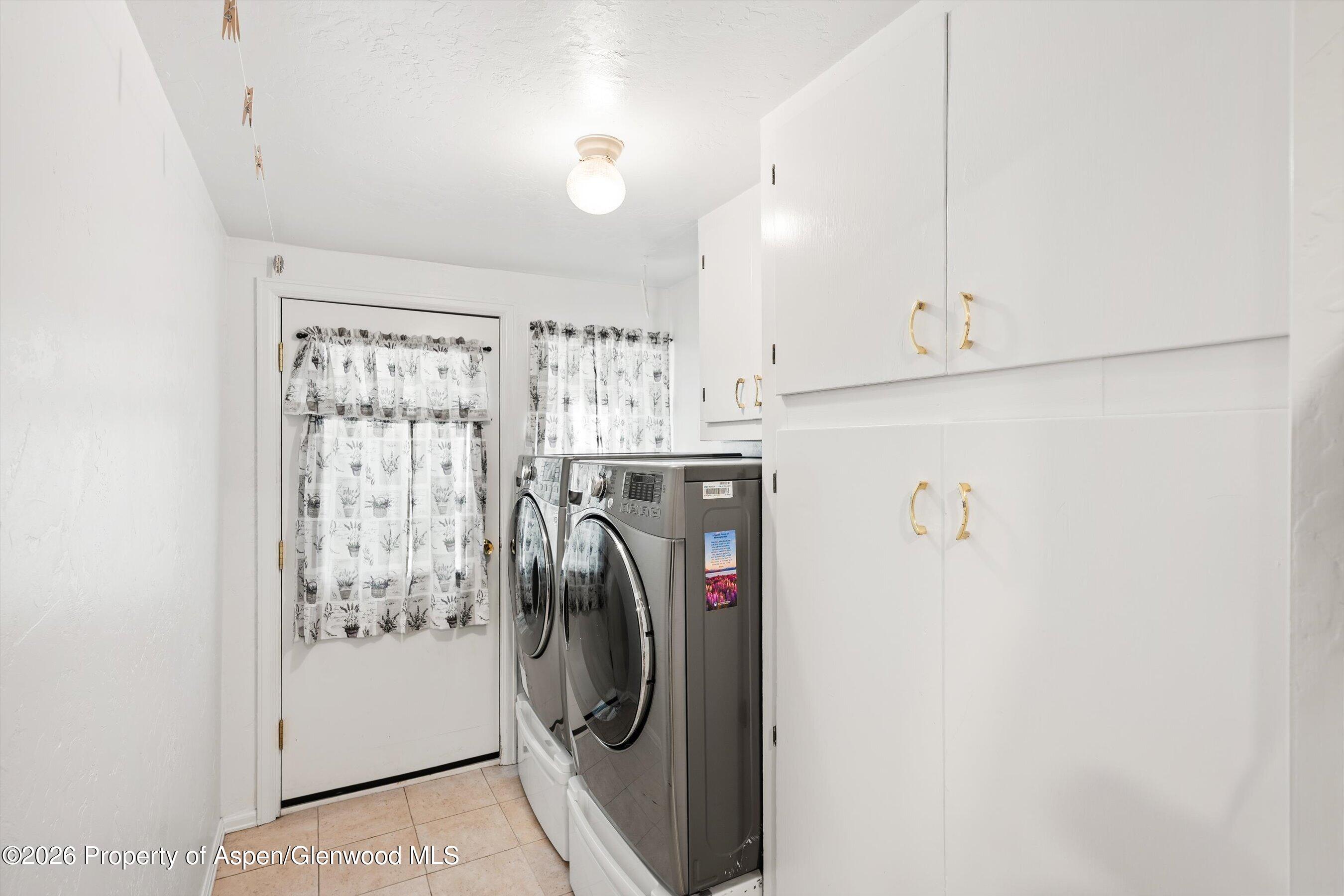 127 Cardinal Way Parachute, CO 81635 - Photo 23 of 41 a utility room with dryer and washer