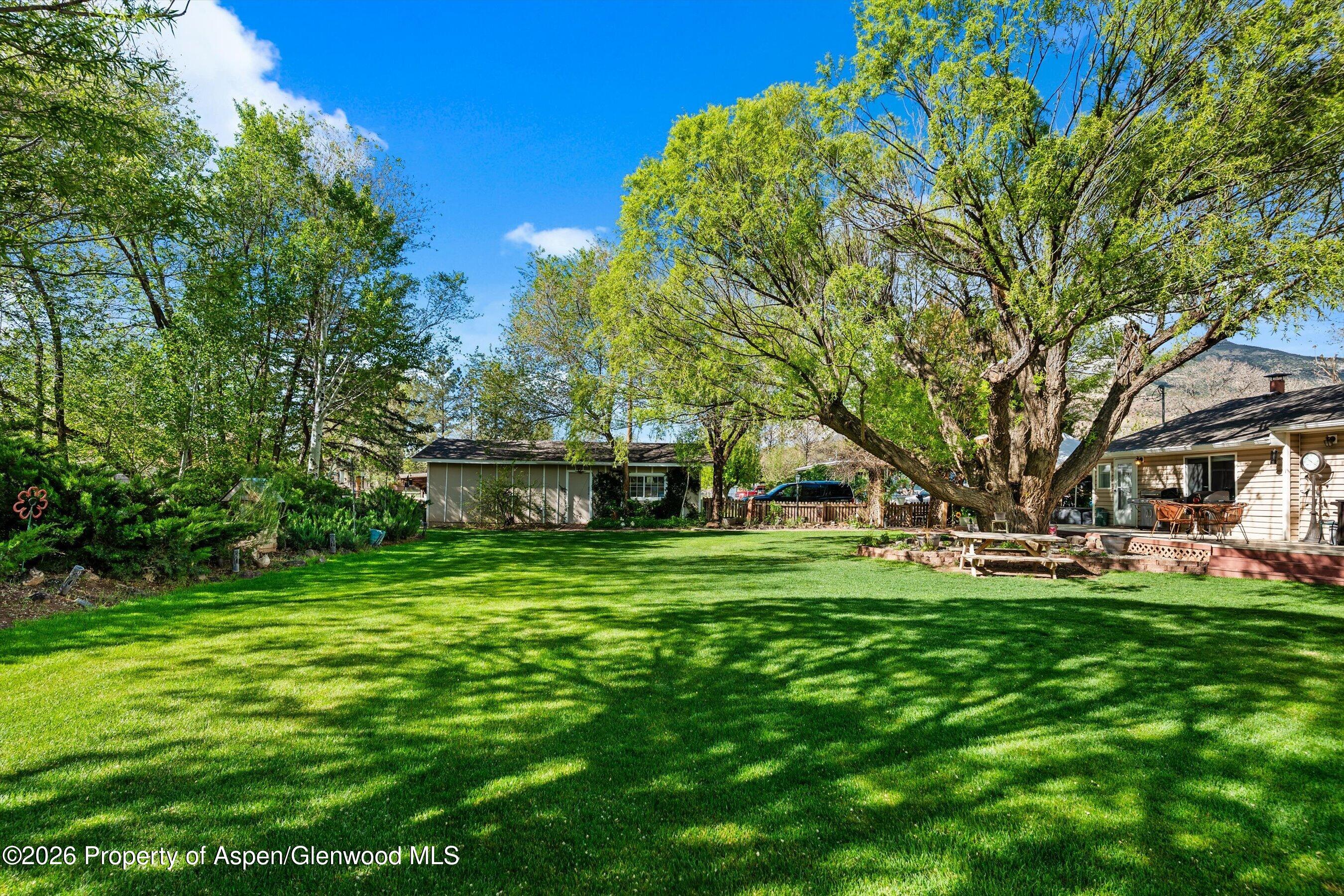 127 Cardinal Way Parachute, CO 81635 - Photo 30 of 41 a front view of a house with a garden