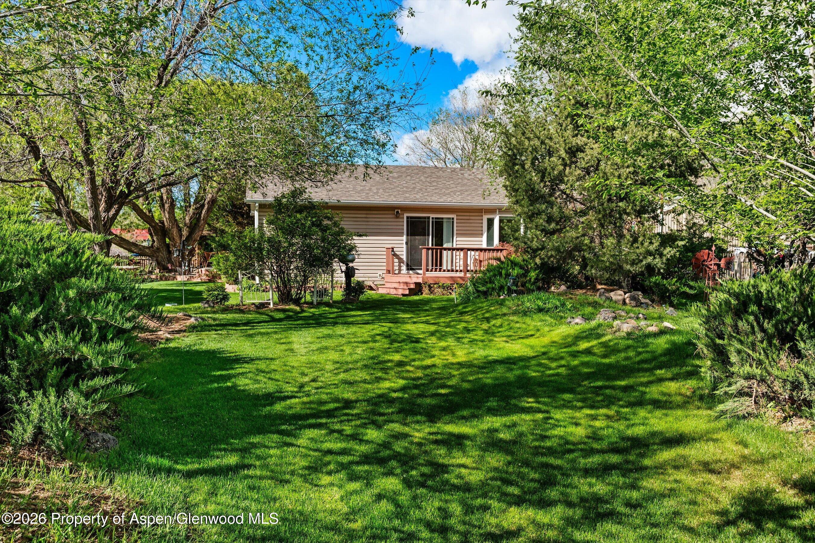 127 Cardinal Way Parachute, CO 81635 - Photo 32 of 41 a view of a house with a yard